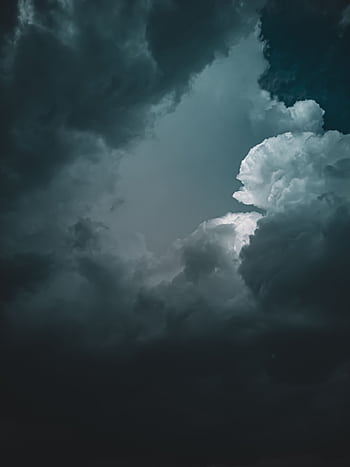 Stunning graph of dramatic dark clouds forming an overcast sky, creating a moody atmosphere. HD phone wallpaper