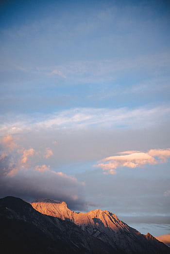 Peaceful mountain landscape with sunset hues in Austria. Perfect for nature lovers. HD phone wallpaper