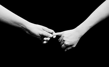 Two hands reaching out in a black and white composition, symbolizing connection. HD wallpaper