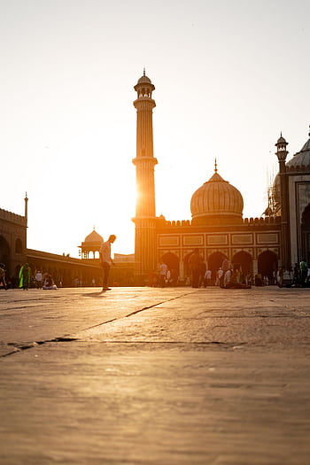 Beautiful evening view of Jama Masjid in New Delhi with people gathering at sunset. HD phone wallpaper