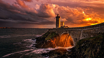 Lighthouse on the rocks, sky, sunset, coast, sea, colors, clouds HD wallpaper