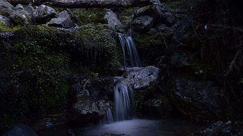 Waterfall Stream Stones Rocks Green Leaves Dark Background Nature HD wallpaper