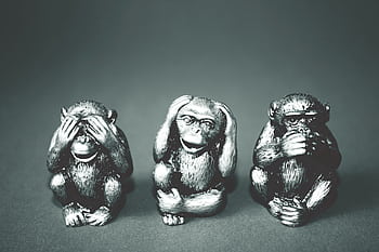 Black and white of three wise monkeys figurines showing the hear no evil, see no evil, speak no evil poses. HD wallpaper