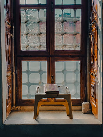 A beautifully displayed Quran on a stand near a mosque window in İstanbul, Turkey. HD phone wallpaper