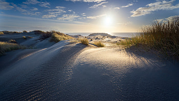 White Beach Sand Grass Mountains Sunlight Under White Clouds Blue Sky Nature HD wallpaper
