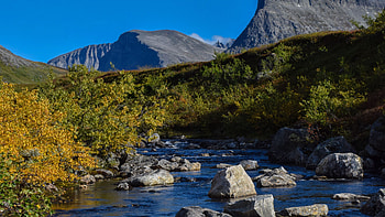Landscape View Of Rock Mountains Stones On River Water Yellow Green Leaves Trees Bushes Slope Blue Sky Background Nature HD wallpaper