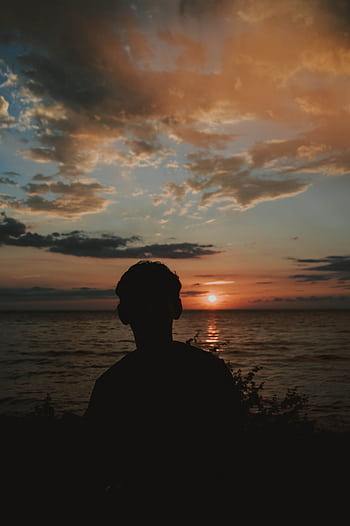 Silhouette of a person against a breathtaking Puerto Vallarta sunset over the ocean. HD phone wallpaper