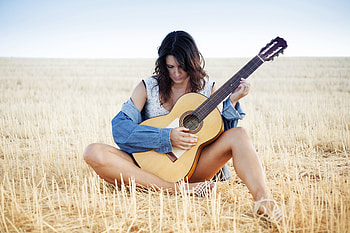 Cowgirl Strumming on her Guitar, guitar, cowgirl, field, brunette HD wallpaper