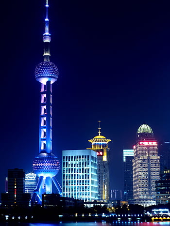 Breathtaking view of Shanghai's illuminated Pudong skyline featuring the Oriental Pearl Tower. HD phone wallpaper