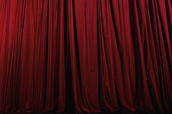 Rich red curtains with elegant drapery, perfect for theater or luxury decor themes. HD wallpaper