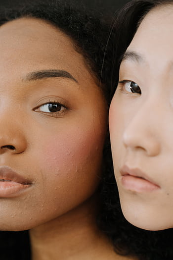 Close-up portrait of two women showcasing diverse beauty and natural skin. HD phone wallpaper