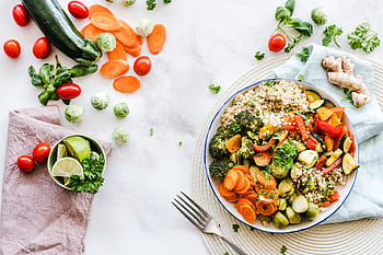 Colorful quinoa salad with fresh vegetables creates a healthy, balanced meal. HD wallpaper