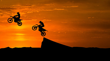 Stunt Bike Race Sunset Silhouette HD wallpaper