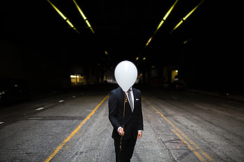 Young Man In Suit Holding Balloons In Front Of Face, man, graphy, balloons, boy HD wallpaper