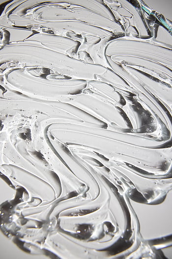 Close-up of an abstract swirling silver liquid texture creating a unique artistic background. HD phone wallpaper