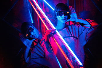 Vibrant cyberpunk portrait with neon lights and reflective textures in Rio. HD wallpaper