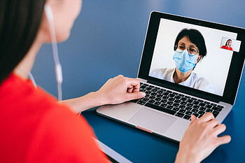 Doctor and patient on a video call for telehealth consultation during COVID-19 era. HD wallpaper