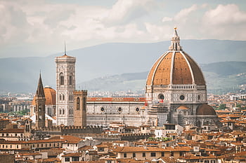 A breathtaking view of Florence Cathedral, also known as Il Duomo, with the cityscape at dawn. HD wallpaper