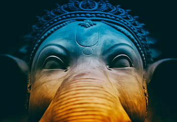 Intricate elephant sculpture resembling Ganesh, showcasing beautiful artistry. HD wallpaper