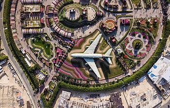 Colorful aerial shot of Dubai Miracle Garden showcasing airplane made of flowers. HD wallpaper