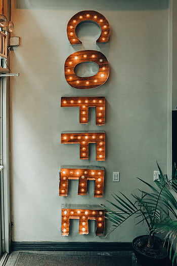 Warm, vintage-style illuminated coffee sign in a New York coffee shop interior. HD phone wallpaper
