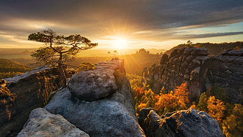 Sunset over the Bastei Mountains of Saxony, Germany, landscape, clouds, trees, sky, sun, forest, rocks, evening HD wallpaper