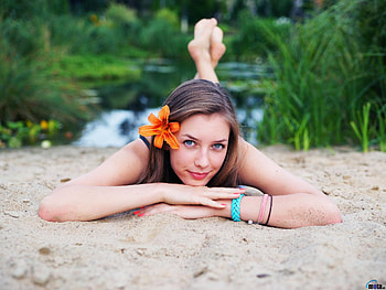 Girl Lying on the Sand, model, sand, lying, flower, girl HD wallpaper