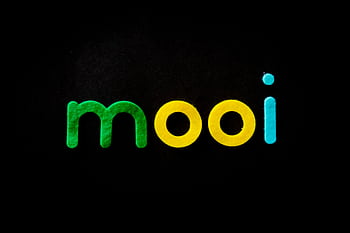 Vibrant and modern typography spells 'mooi' in green, yellow, and blue on black. HD wallpaper
