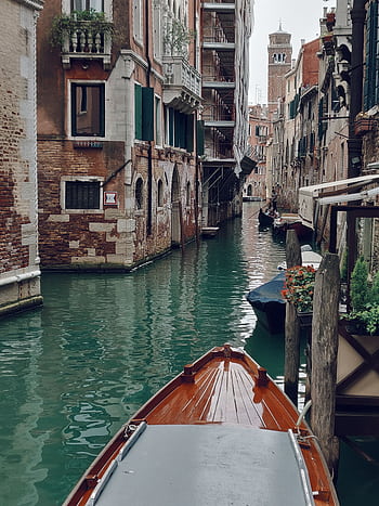 Explore the charm of Venetian canals with historic architecture and gondolas HD phone wallpaper