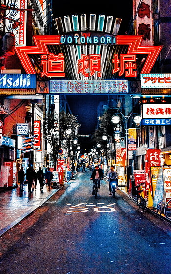 Explore the neon-lit streets of Dotonbori in Osaka, Japan, a bustling hub of nightlife and culture. HD phone wallpaper