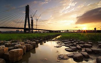 Cities, Rivers, Grass, Stones, Sky, City, Building, Bridge, Evening HD wallpaper