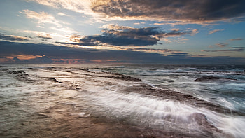 Rocky Reef, blue, rocky, beaches, beautiful, dusk, reef, clouds, nature, sky, sun, refraction HD wallpaper