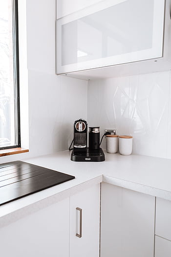 Bright kitchen corner with a stylish coffee maker and minimalistic design. HD phone wallpaper