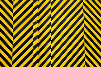 Dynamic yellow and black patterned background with bold diagonal stripes for creative design use. HD wallpaper