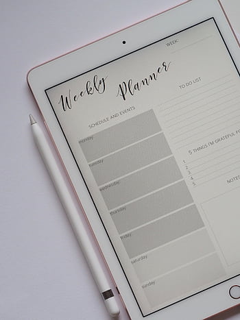 Close-up of a digital weekly planner displayed on a tablet with stylus. HD phone wallpaper