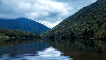 Lake Kaurapataka, New Zealand, hills, clouds, sky, water, reflections HD wallpaper