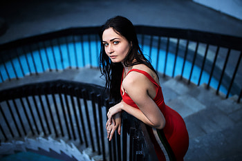 Woman in red dress, stare, dark hair HD wallpaper