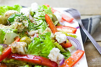 Colorful Greek salad with fresh vegetables and feta cheese. HD wallpaper