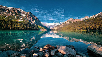 Lake Louise, Banff NP, Alberta, stones, canada, mountains, rocks, water, reflections HD wallpaper