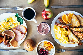 Vibrant breakfast with eggs, fruits, toast, and coffee for a wholesome start. HD wallpaper