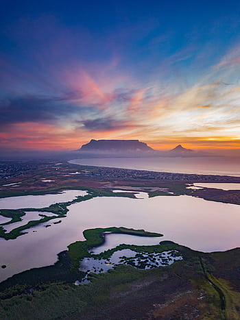 Stunning aerial view of Table Mountain with vibrant sunset skies and serene landscapes. HD phone wallpaper