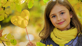 Cute Little Girl Is Standing In Blur Yellow Background Wearing Blue Yellow Dress Cute HD wallpaper