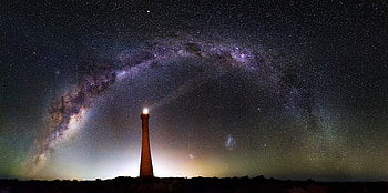 Milky Way Over Lighthouse , lighthouse, milky-way, digital-universe, graphy HD wallpaper
