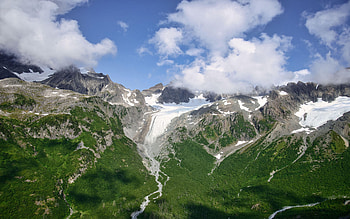 Flying through the glacier laden peaks near Seward, Alaska, landscape, clouds, sky, usa, mountain HD wallpaper