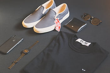 A modern collection of men's fashion essentials flat lay, featuring shoes, watch, , and eyewear for a sleek style. HD wallpaper