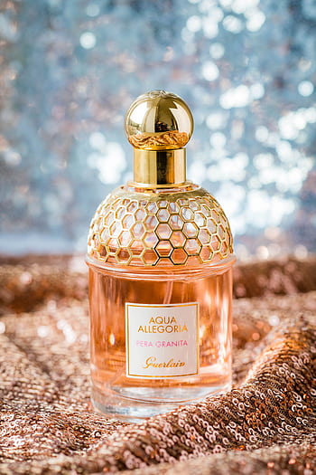 Glistening perfume bottle on a sparkly, elegant background. HD phone wallpaper