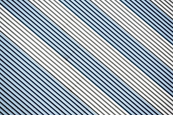 Abstract diagonal stripes in metallic tones create a dynamic modern design. HD wallpaper