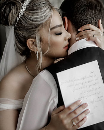 A bride and groom sharing an intimate embrace, highlighting romance and wedding elegance. HD phone wallpaper