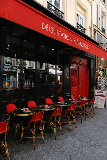 Paris café with red chairs and black tables, ideal for al fresco dining and experiencing French culture. HD phone wallpaper