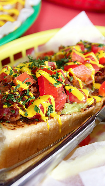 Hot dog with toppings, Ketchup and mustard, Fresh lettuce, Dressed for perfection HD phone wallpaper